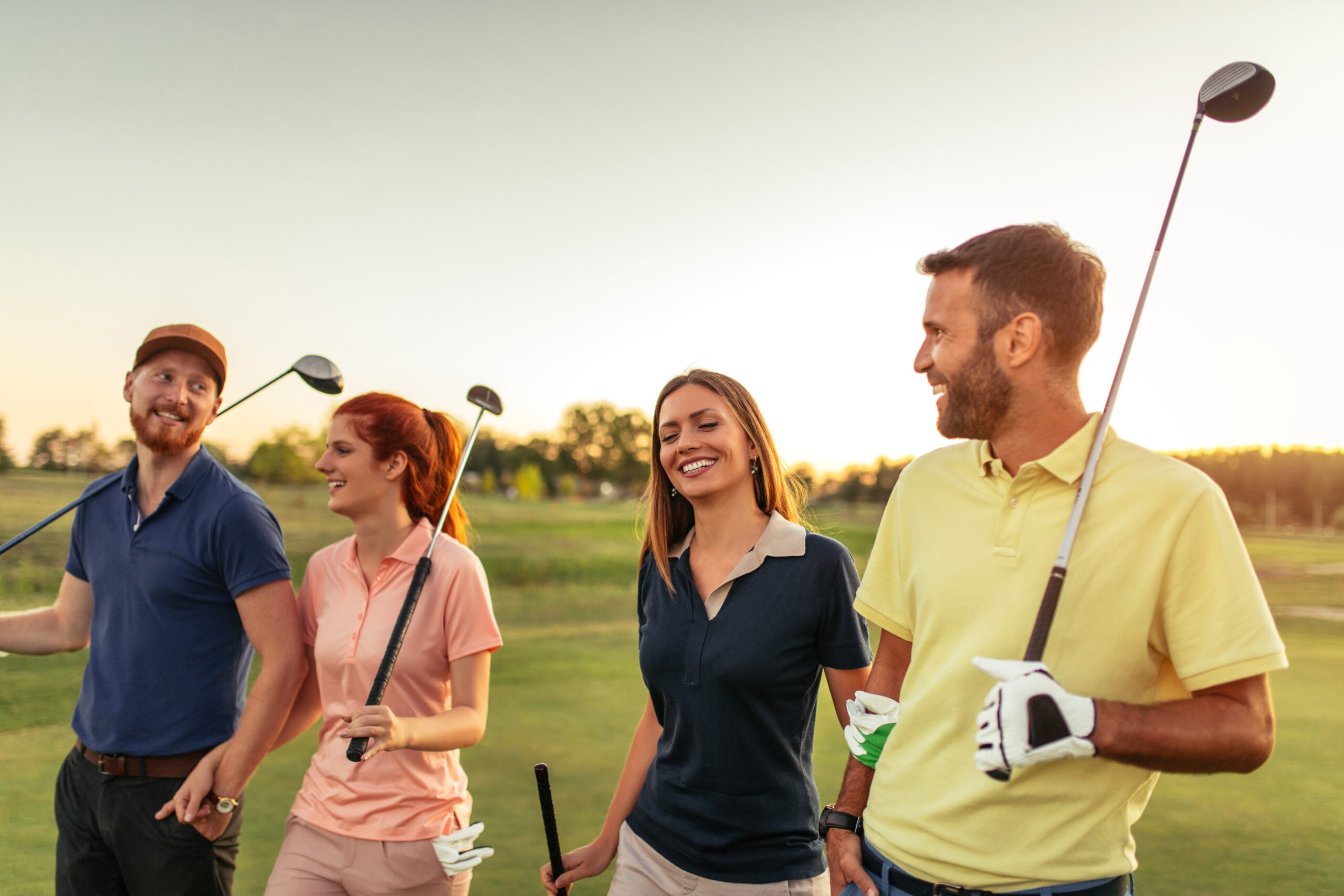 Group of friends walking on the golf course